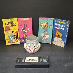 collection of vintage Looney Tunes and Tom and Jerry merchandise, bugs mug